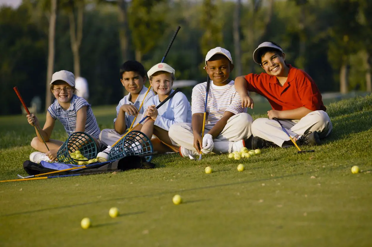 kids learning how to play golf